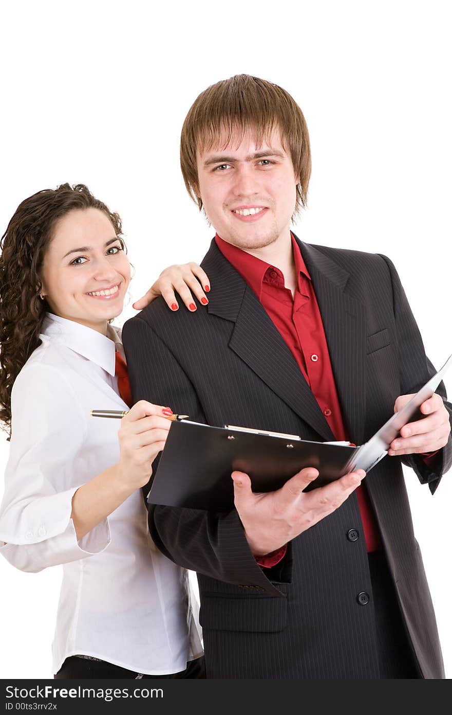 Smiling man and woman dressed for office stand with a carpet. Smiling man and woman dressed for office stand with a carpet