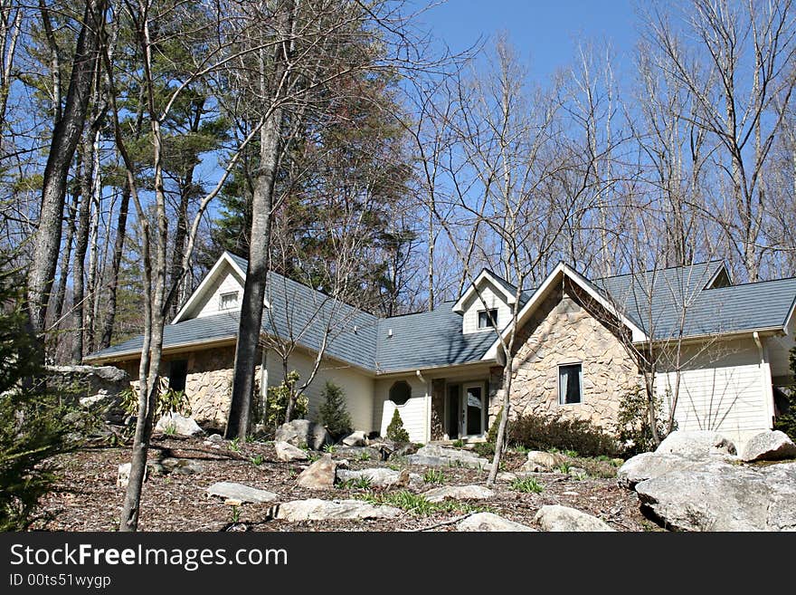 A modern American home with rocky landscaping. A modern American home with rocky landscaping