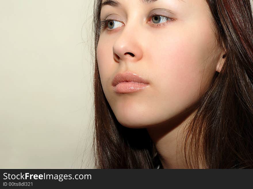 Portrait of the young beautiful girl close-up. Portrait of the young beautiful girl close-up