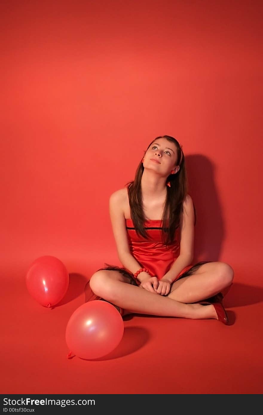 Woman with balloons after a party.