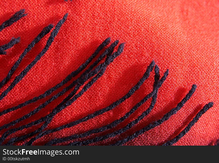 Brushes on a background of a textile cloth from a wool of red color. Brushes on a background of a textile cloth from a wool of red color