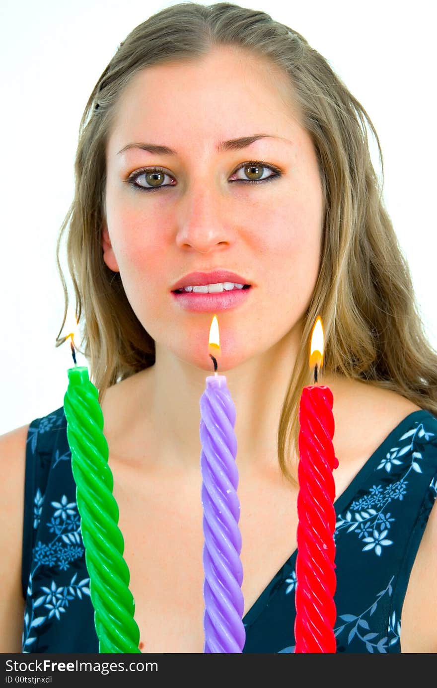 Smiling elegant girl with three colored candles. Smiling elegant girl with three colored candles