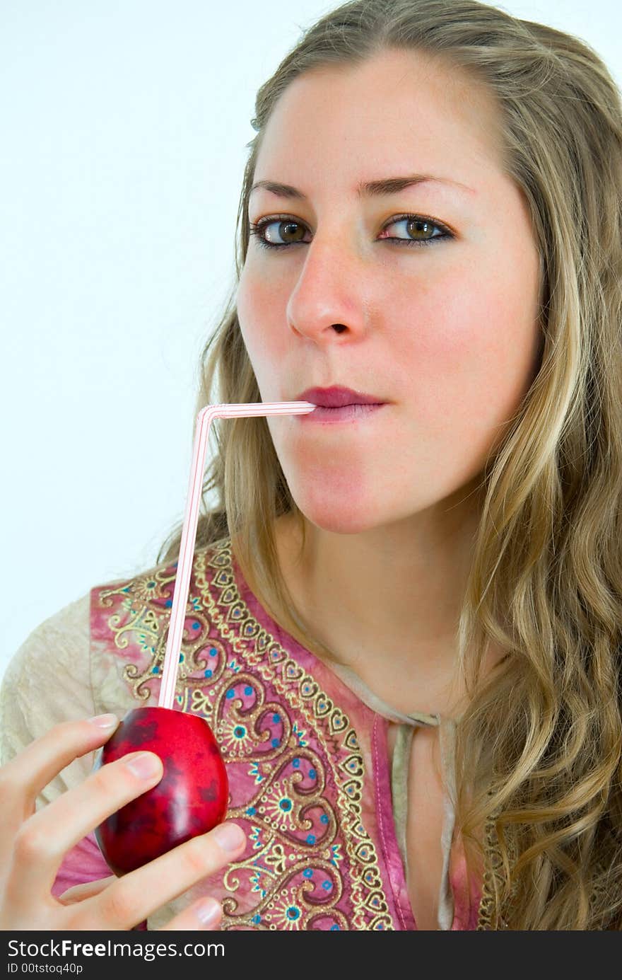 Young lady drinking a tropical juice