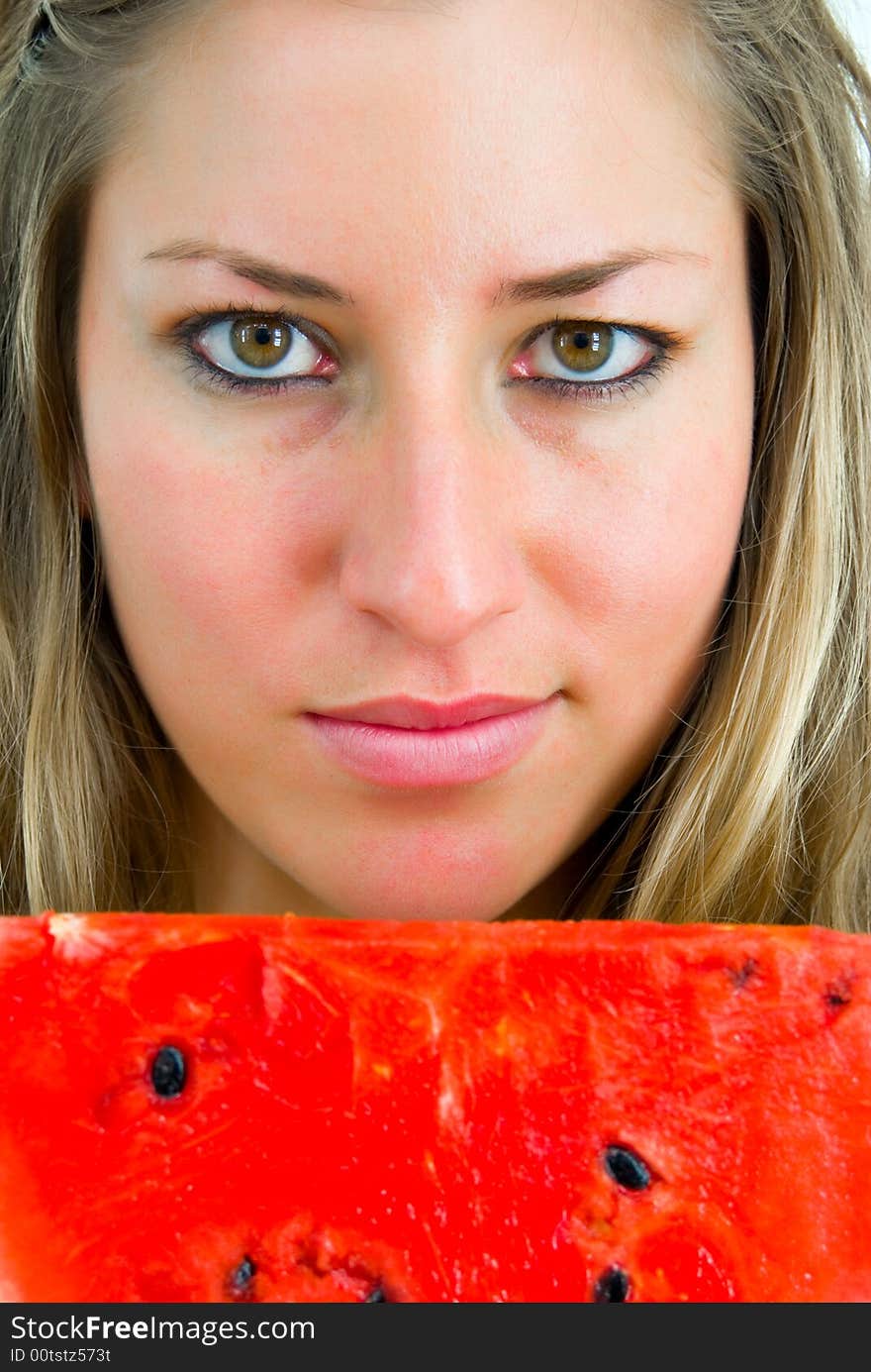 Close-up portrait of a girl with red water-melon. Close-up portrait of a girl with red water-melon