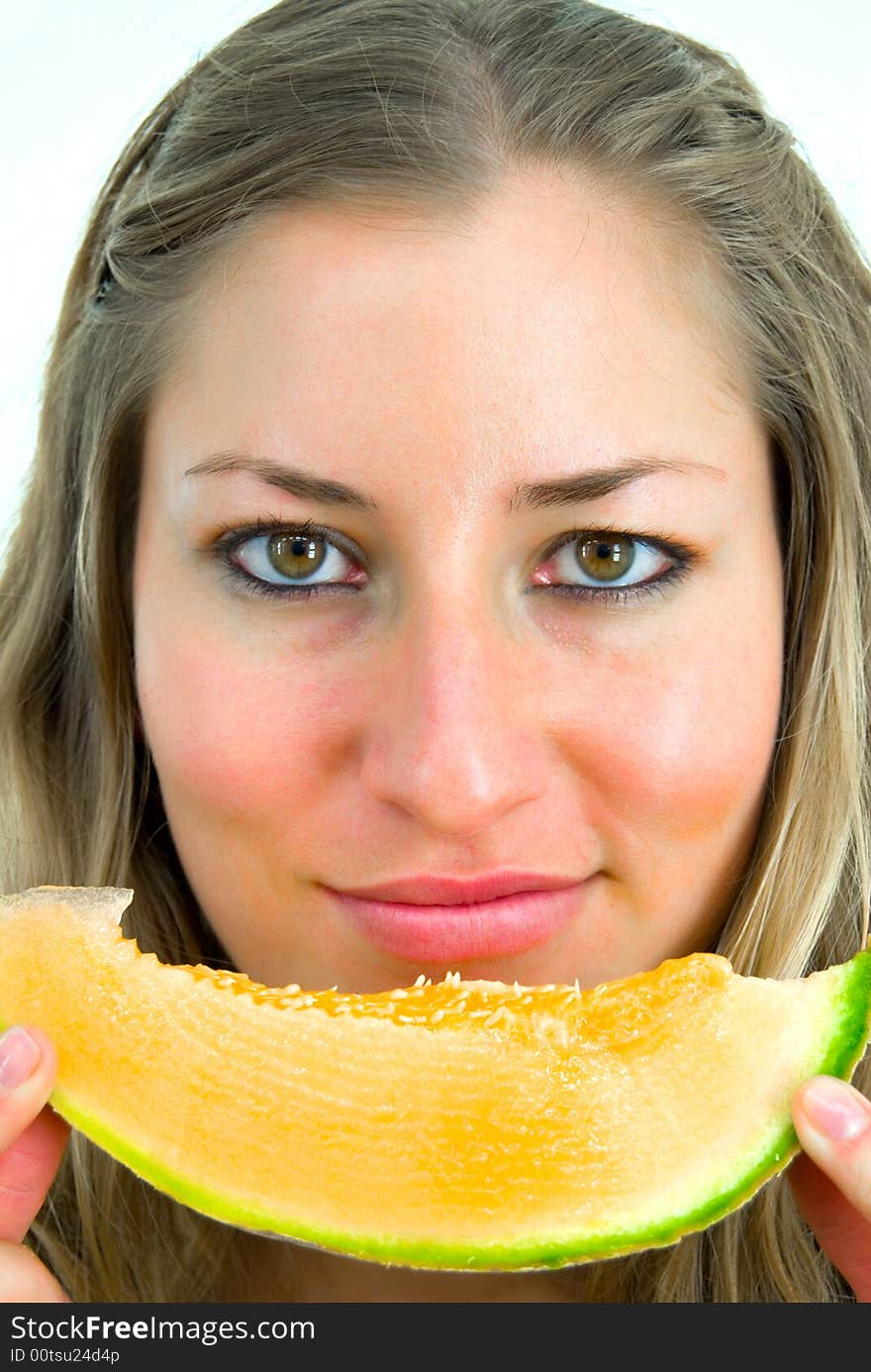 Close-up portrait of a girl with yellow melon. Close-up portrait of a girl with yellow melon