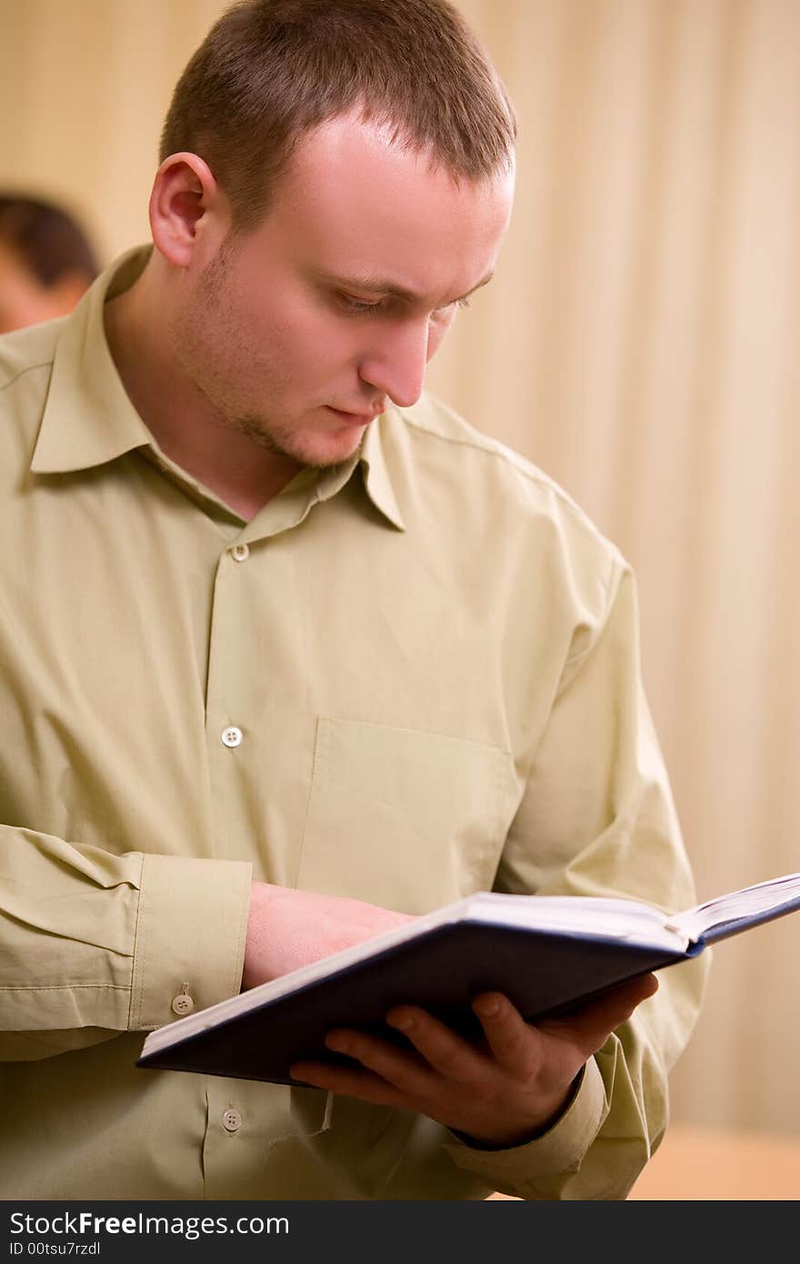 Young businessman at office concentrating at paperwork