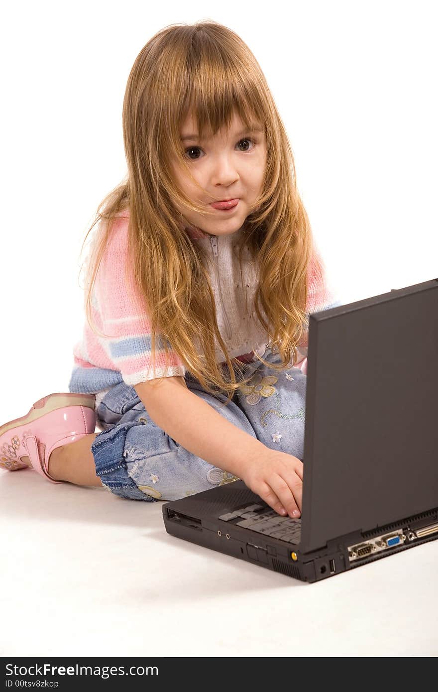 Nice little girl with laptop