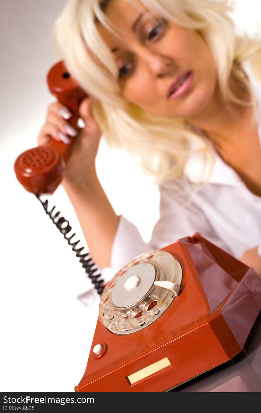 Blond Caucasian Model With Red Phone