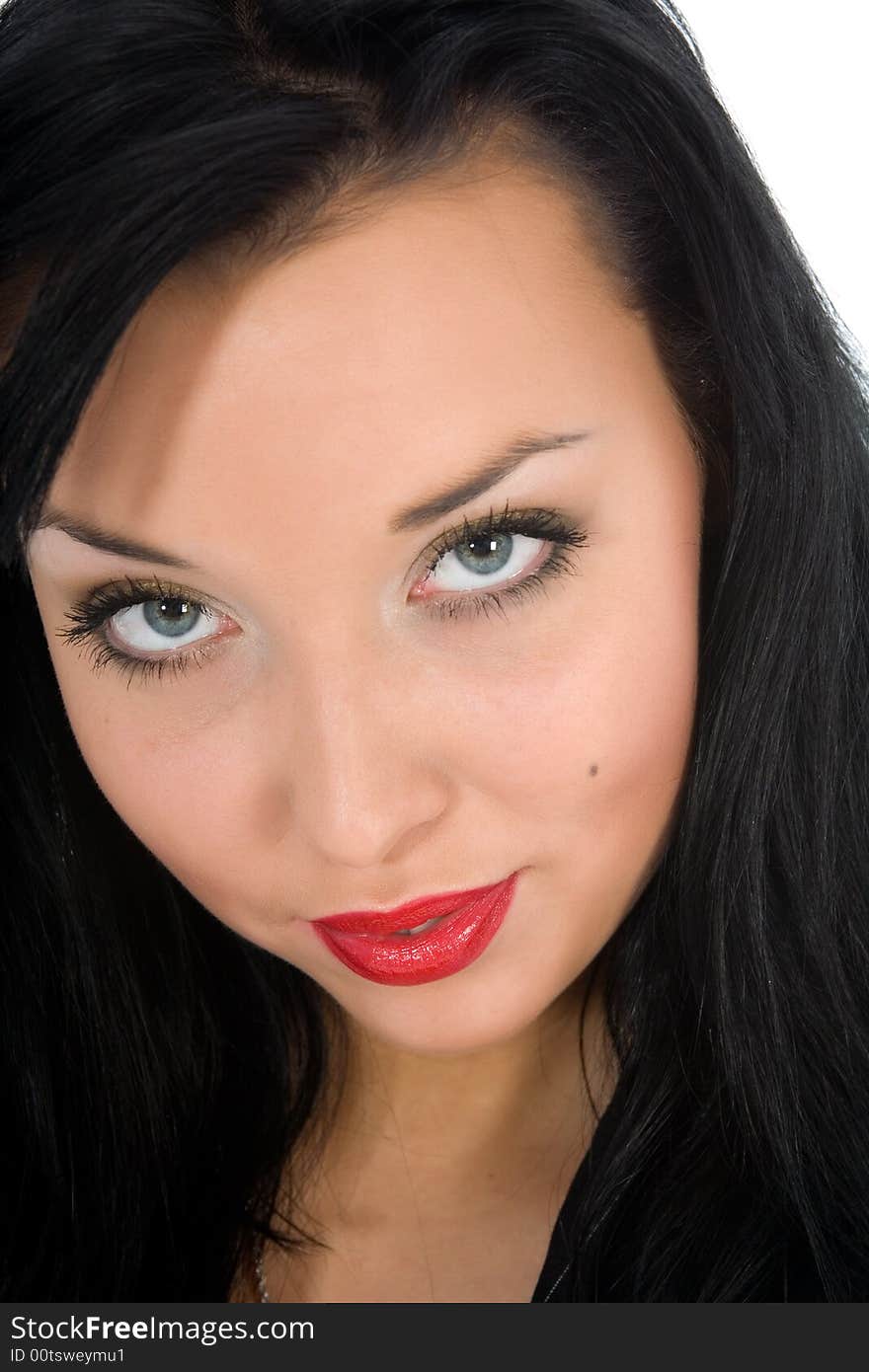 Portrait of the brunette with blue eye on white background