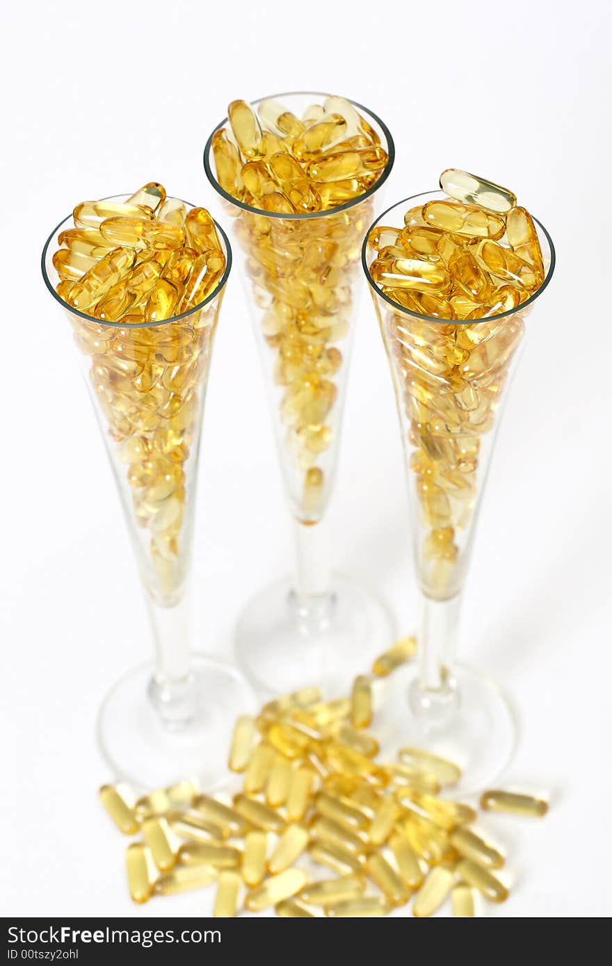 Three glasses with gold boluses