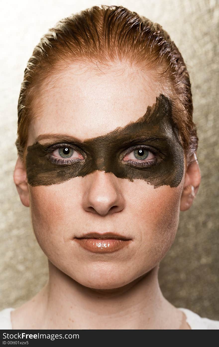 Strange Make-up on a woman's face. Big dark stripe over both eyes. Strict hairs. Strange Make-up on a woman's face. Big dark stripe over both eyes. Strict hairs.