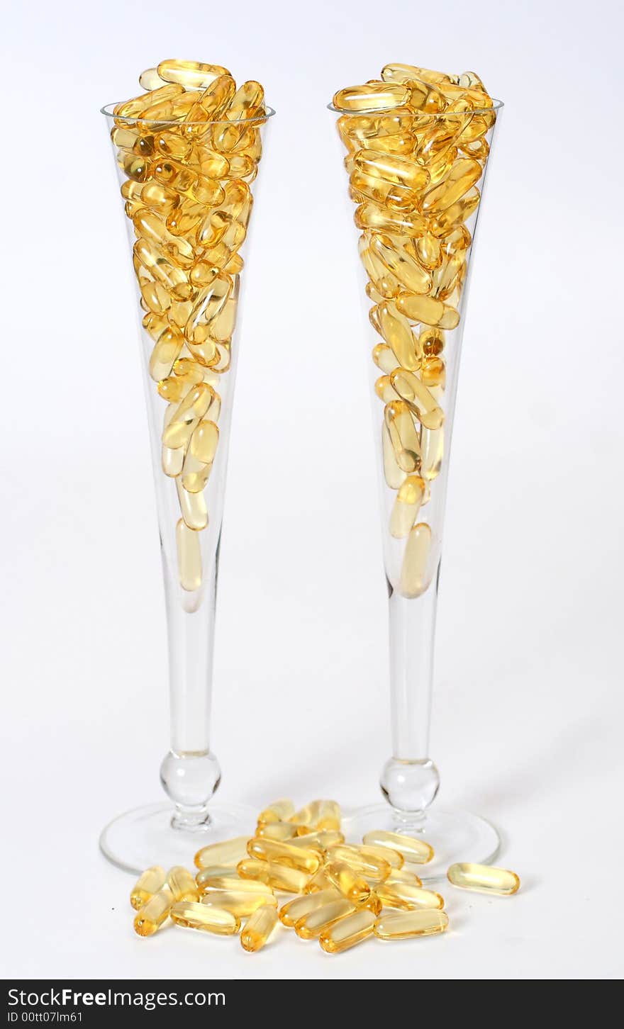 Two Glasses With Gold Boluses