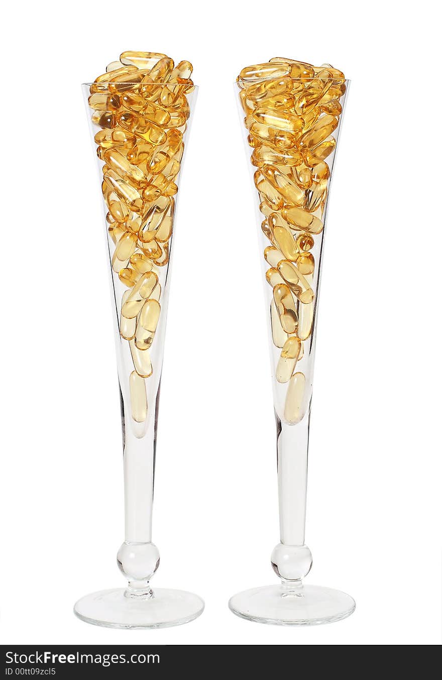 Two glasses with gold boluses