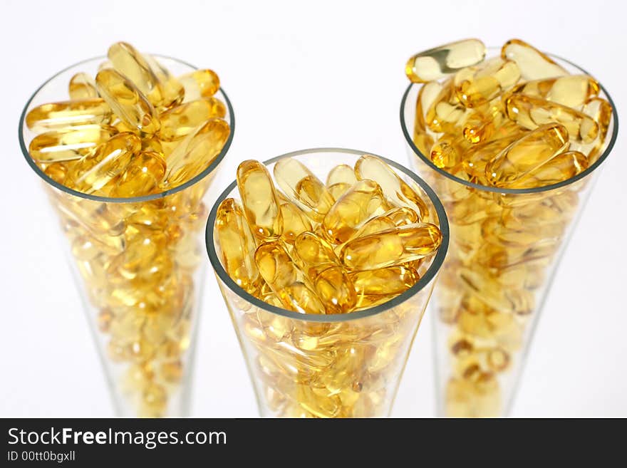 Three glasses with gold boluses