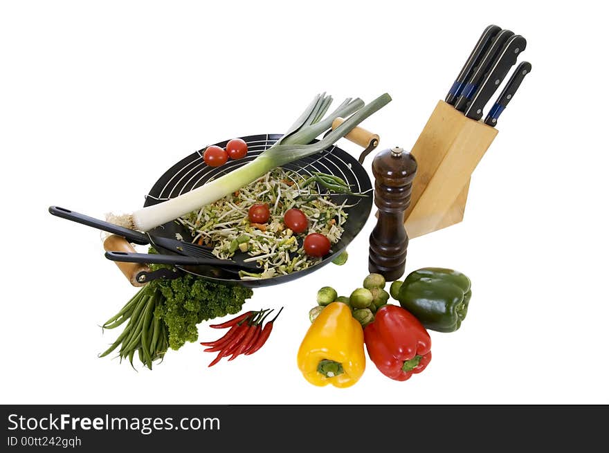 Preparing wok with fresh vegetables on cuttingboard, white background,