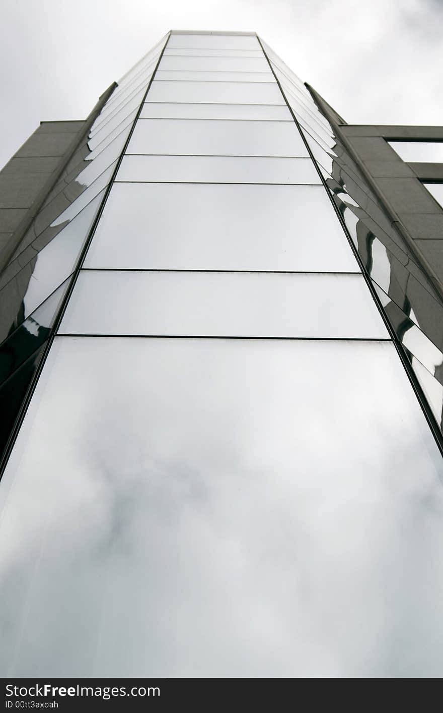 Modern glossy building perspective with sky reflections. Modern glossy building perspective with sky reflections