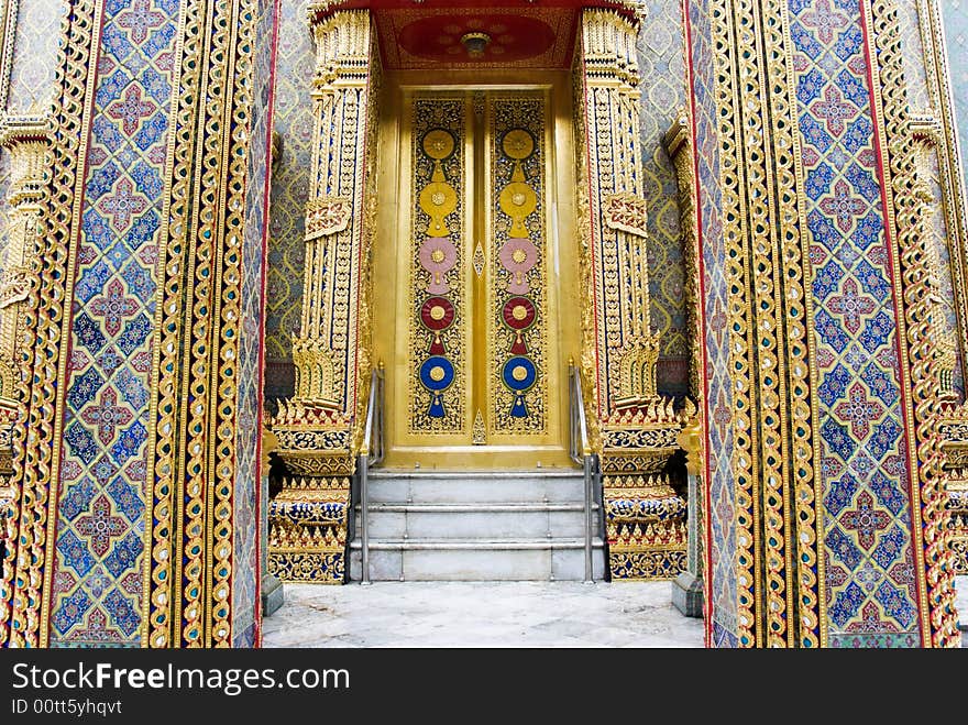 Golden buddhist temple with decorated walls