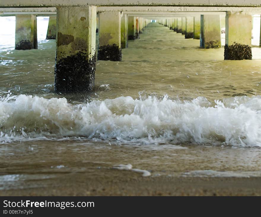 The sea under the jetty at low tide. The sea under the jetty at low tide