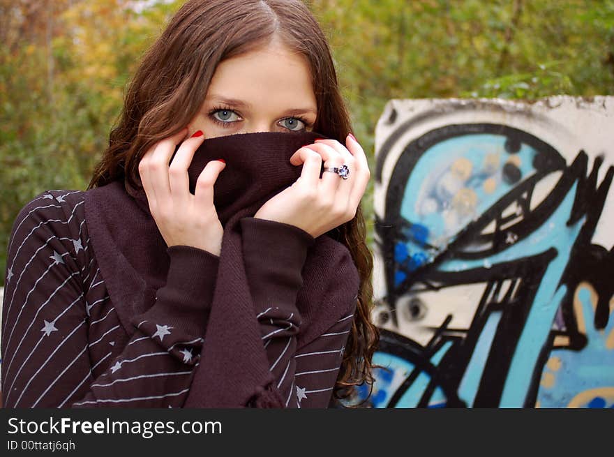 Girl near the graffiti wall