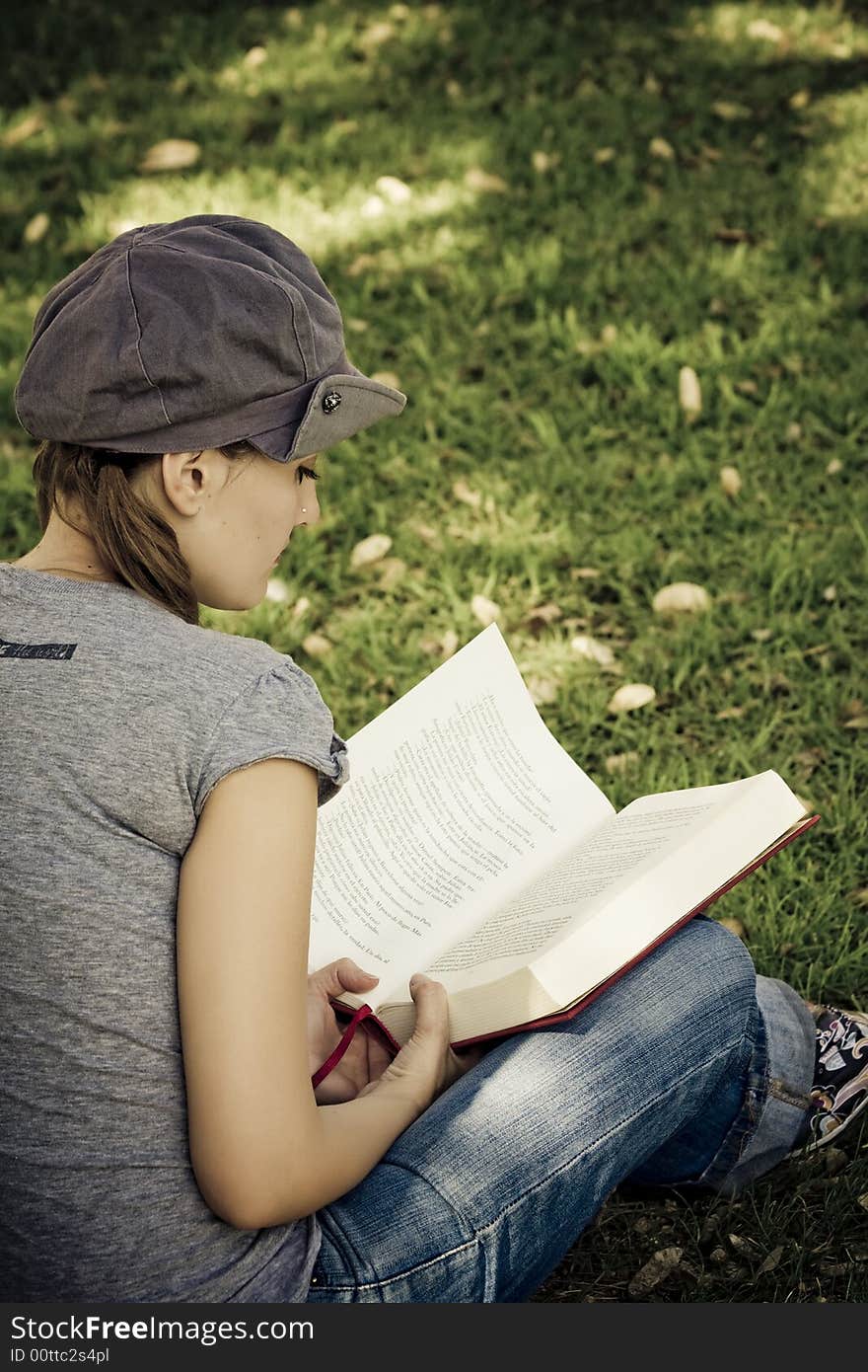 Young woman enjoying a book. Young woman enjoying a book