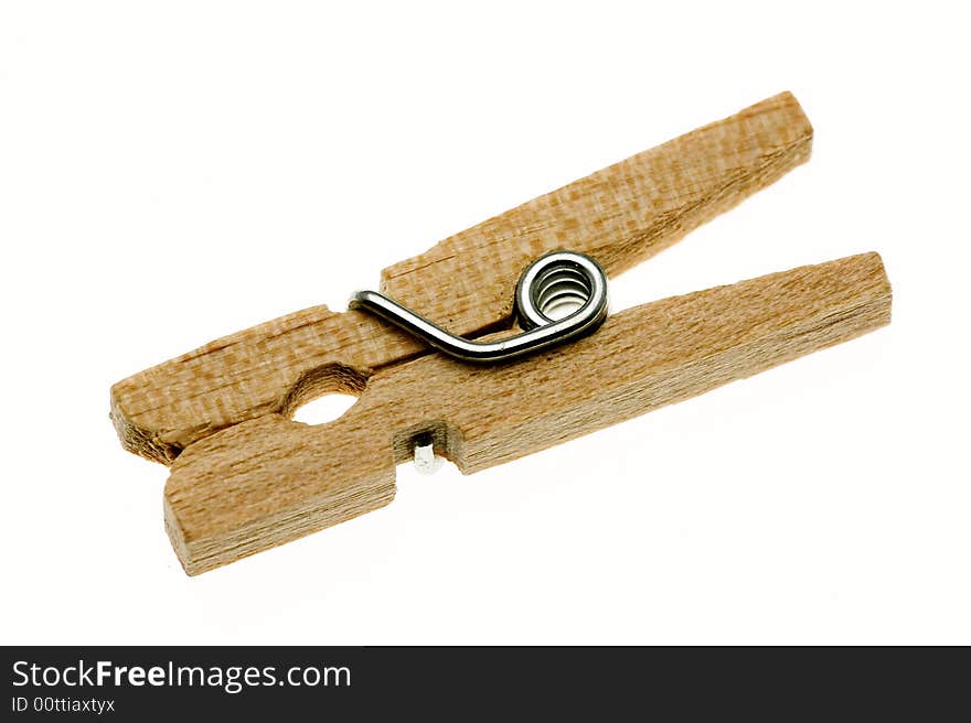 One isolated wooden clothespin (peg). One isolated wooden clothespin (peg)