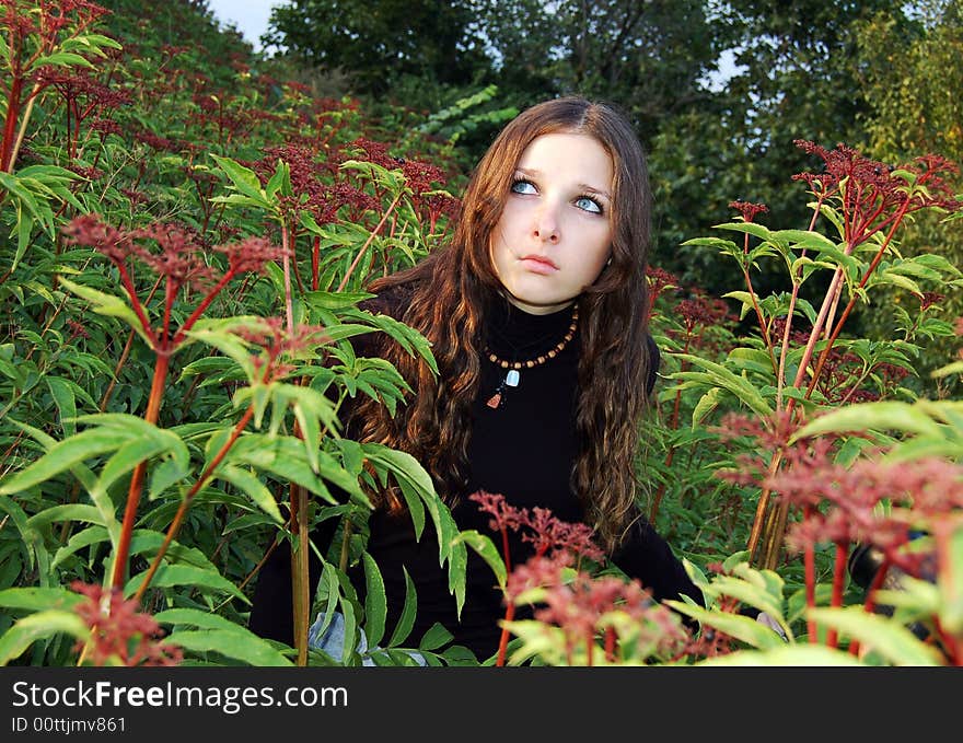 Teenage girl in high grass alone