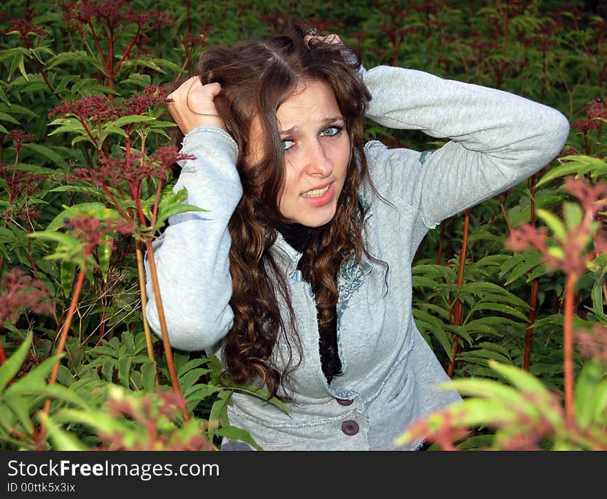 Teenage girl in high grass alone