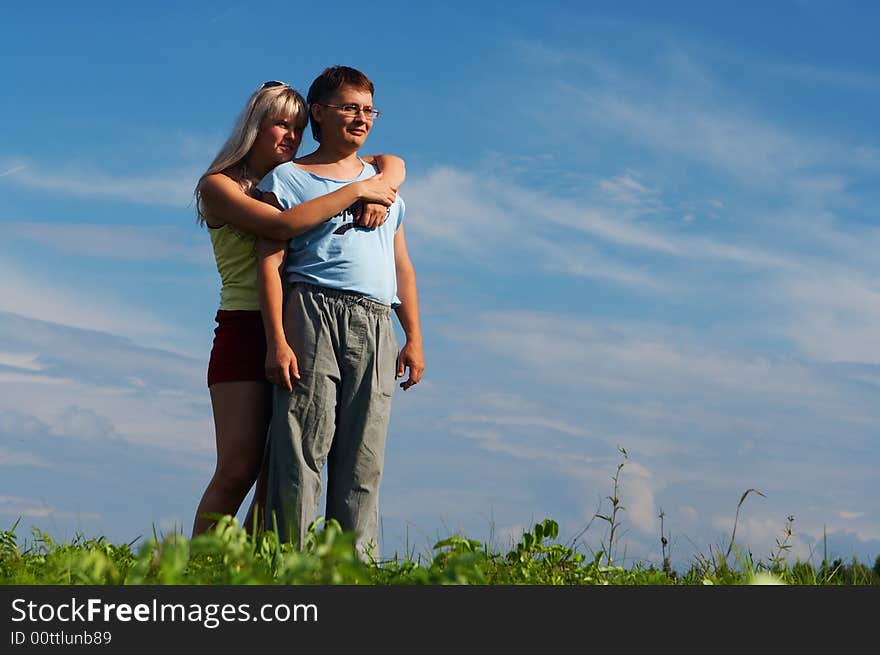 Couple woman and man under blue sky