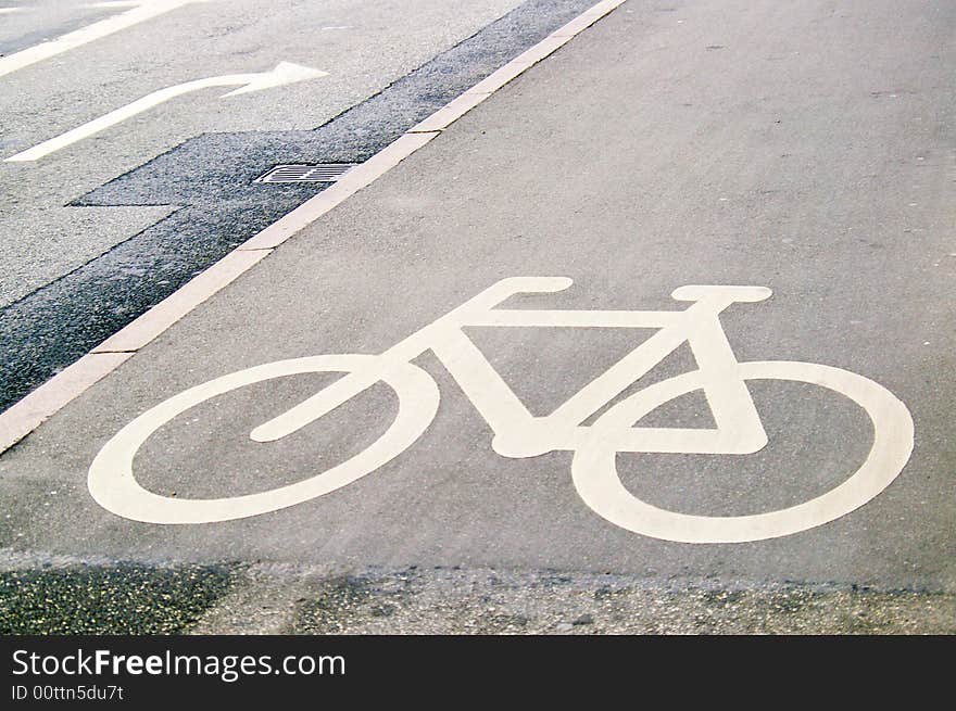 White bicycle sign on the road. White bicycle sign on the road