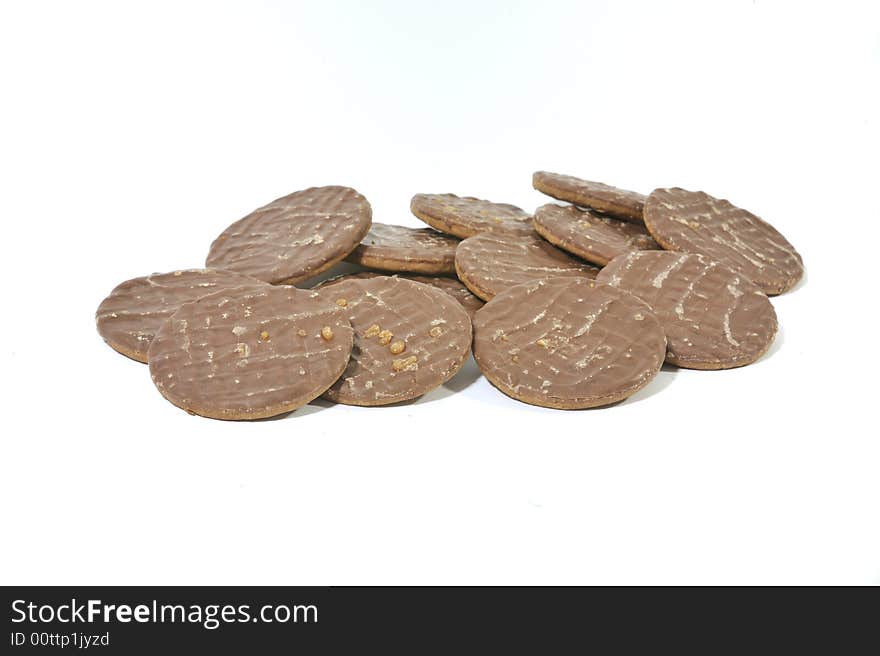 Pile of Chocolate Biscuits on a white background.