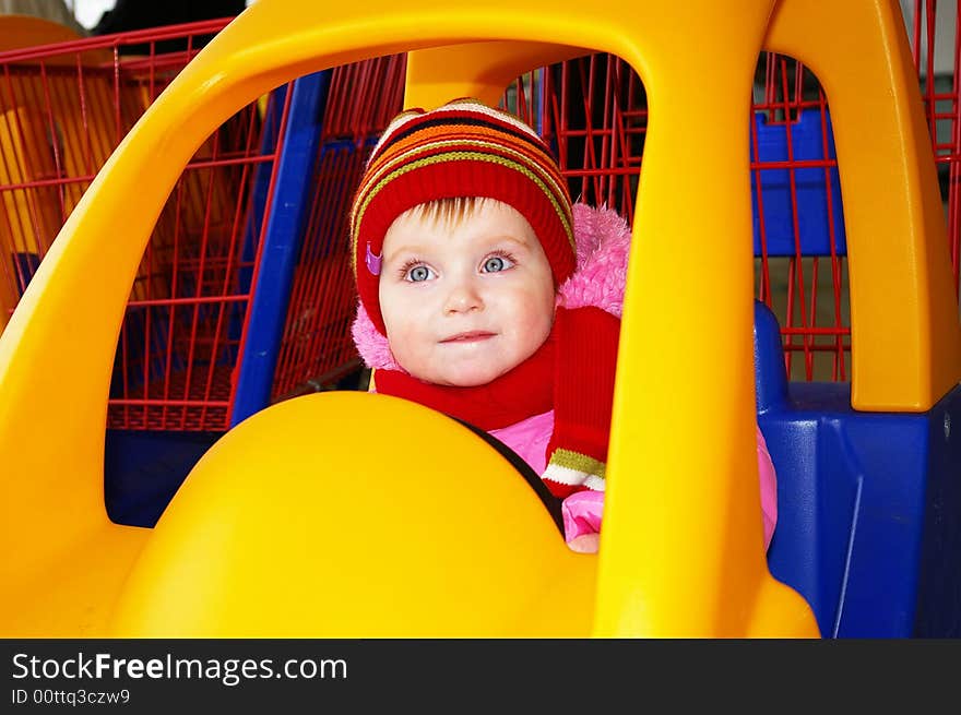 Little Girl In The Carriage  In A Supermarket