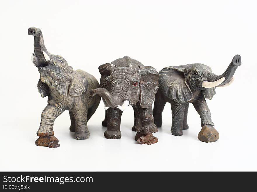 Three ceramic elephant figurines