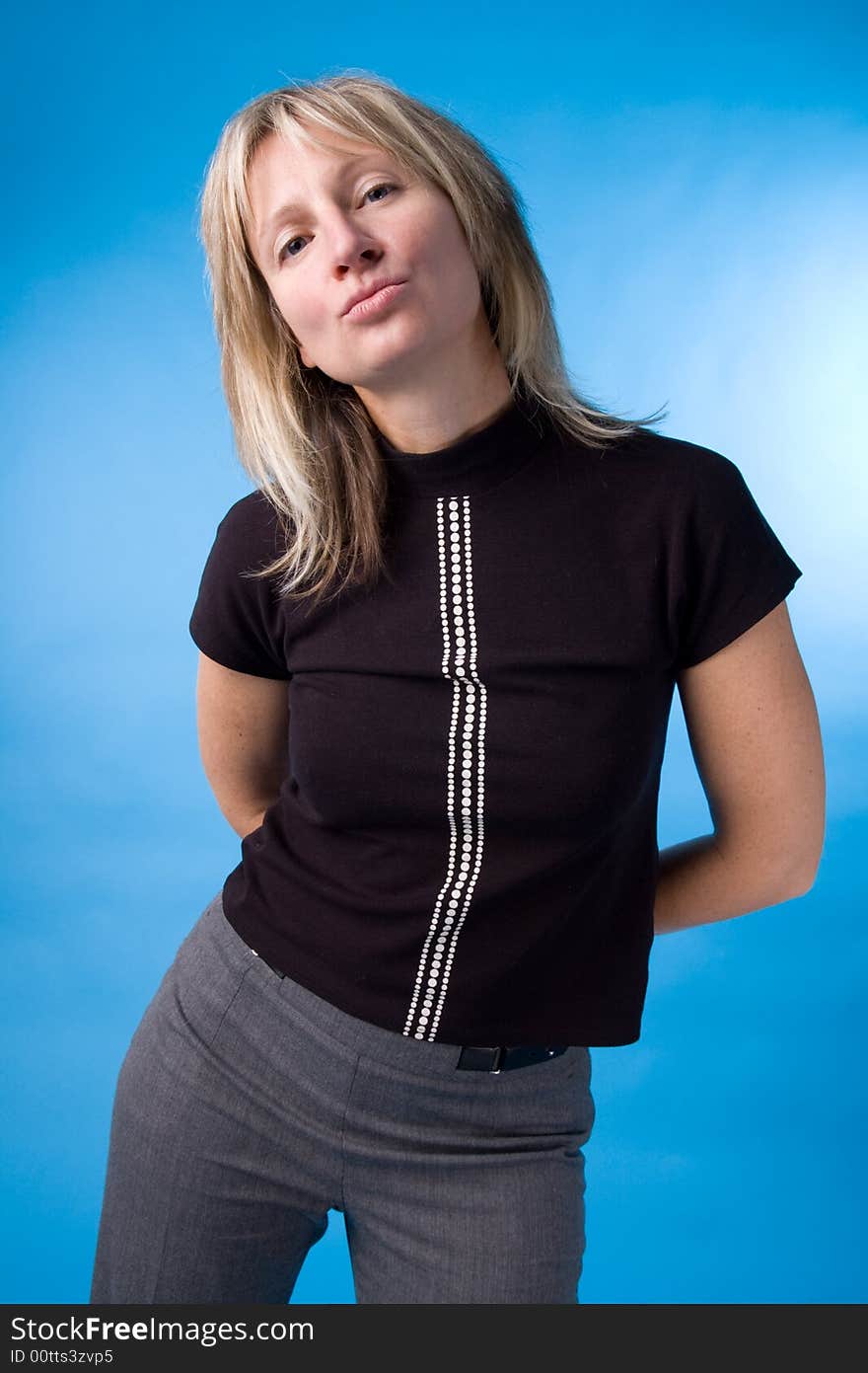 The woman in a black jacket on a dark blue background