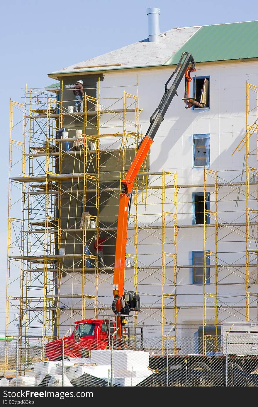 New hotel going up in town, Delivery truck is bring sheetrock to upper floors. New hotel going up in town, Delivery truck is bring sheetrock to upper floors