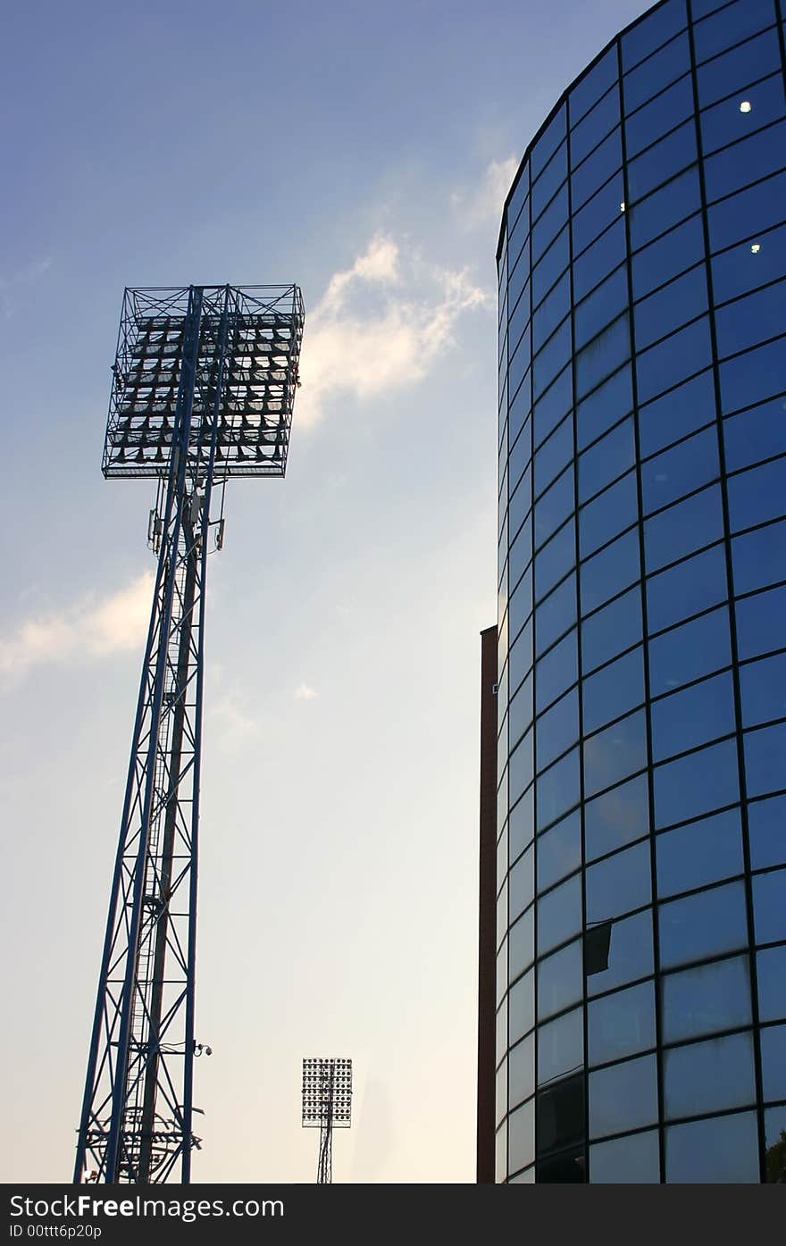 Silhouette of floodlights against on a stadium