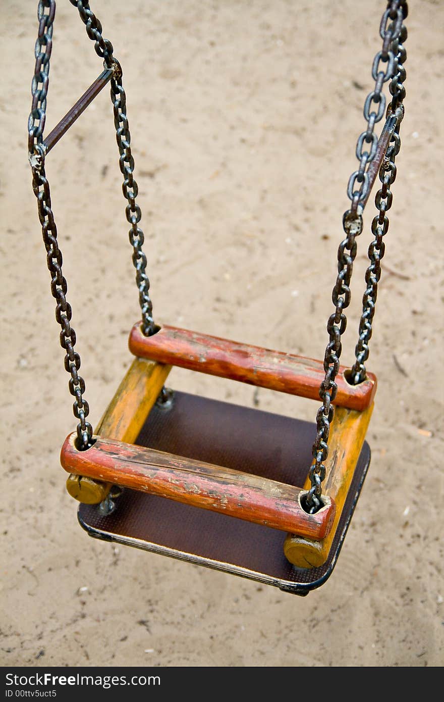 The swing with chains in the park