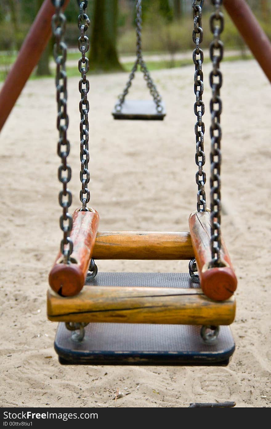 The swing with chains in the park