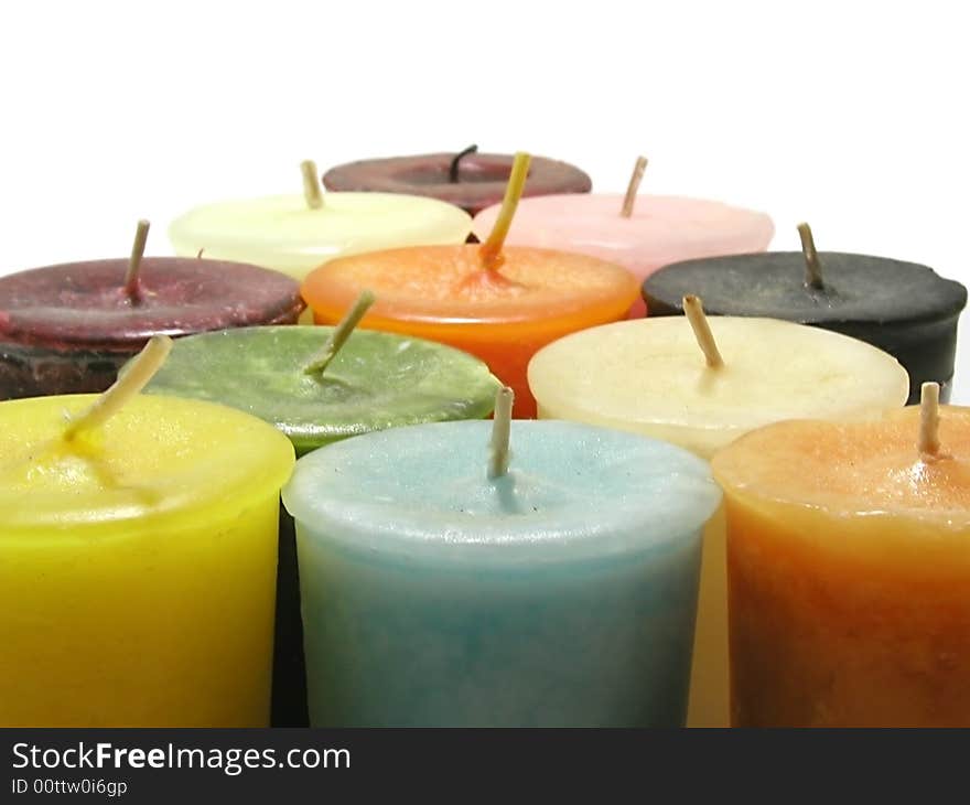 Candles arranged in the form of a pyramid on a white background. Candles arranged in the form of a pyramid on a white background.