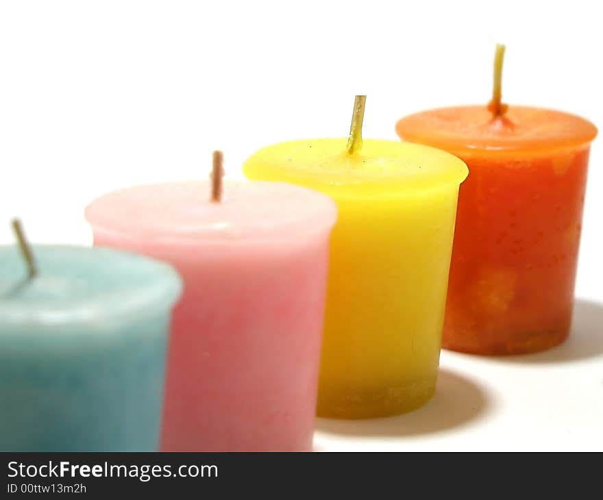 Four candles lined and isolated on a white background. Four candles lined and isolated on a white background.