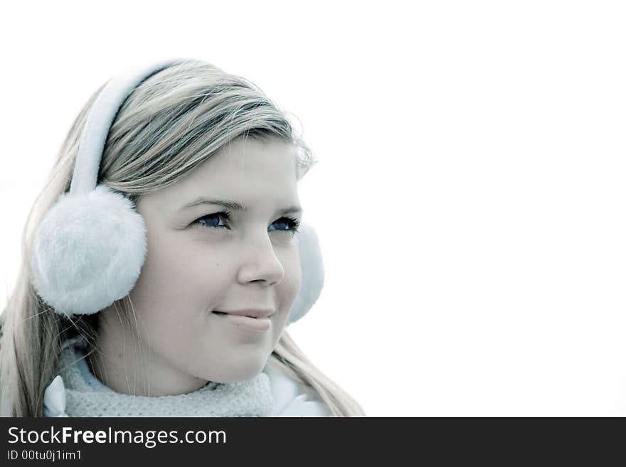 Cheerful cute girl in muffs