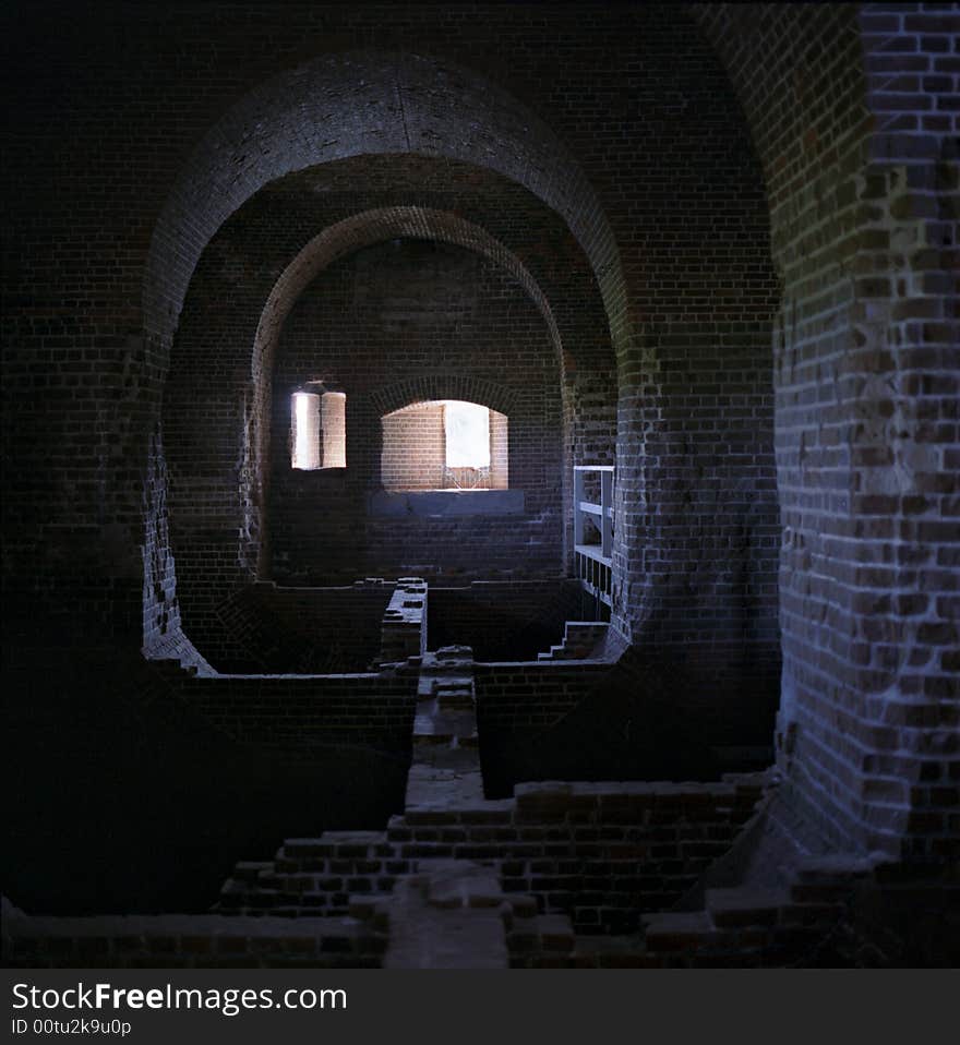 The inside of an old fort in Florida where the wooden floor has been removed leaving the foundation. The inside of an old fort in Florida where the wooden floor has been removed leaving the foundation.