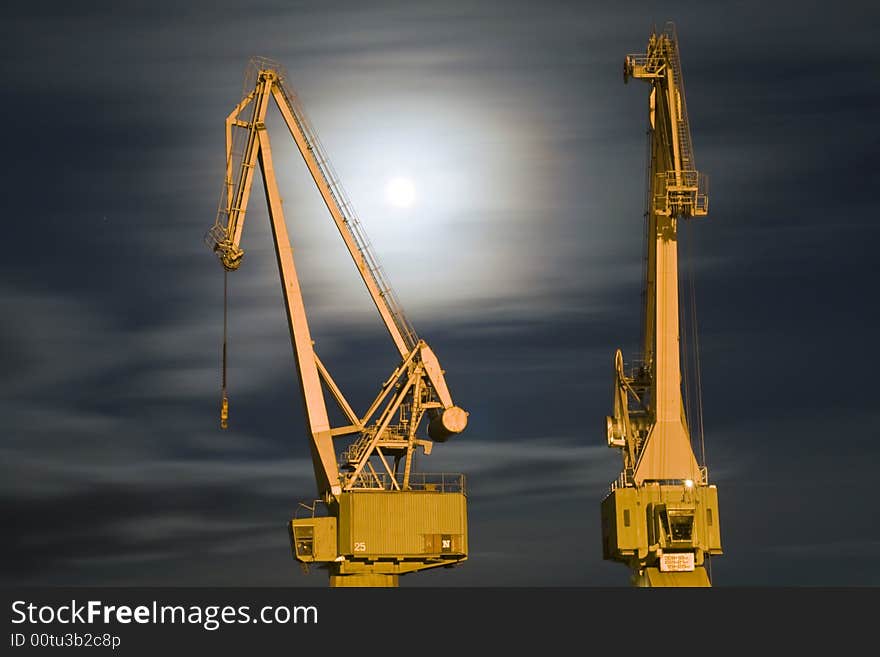 Two old cranes and moonlight