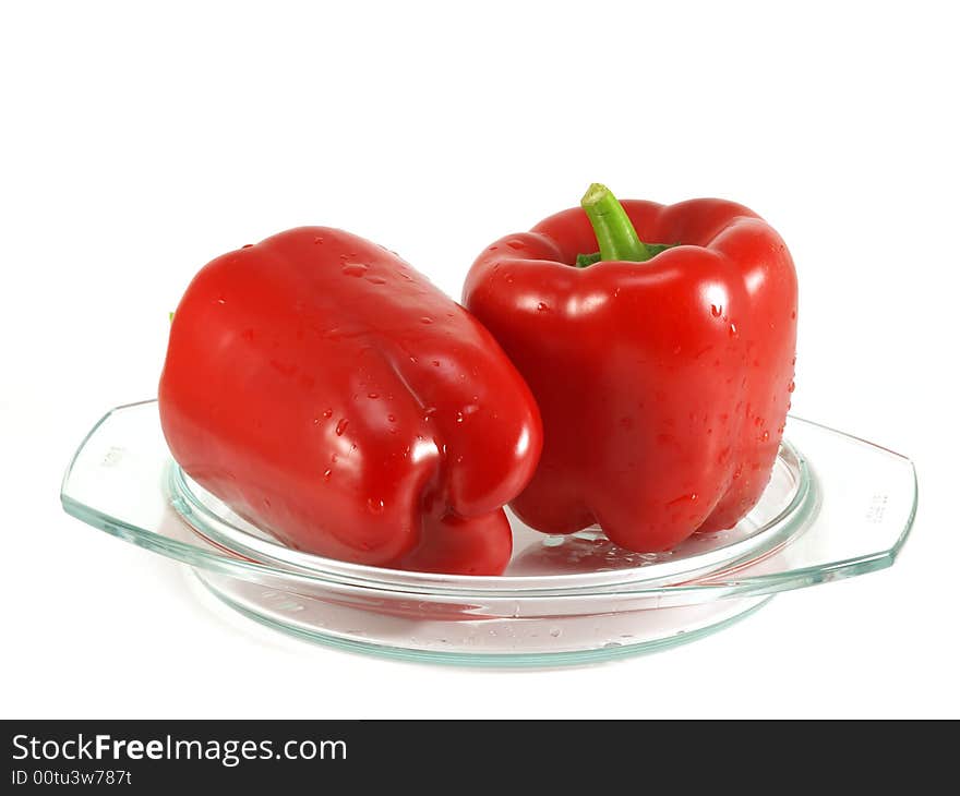 Red pepper and leaves of salad isolated on a white background