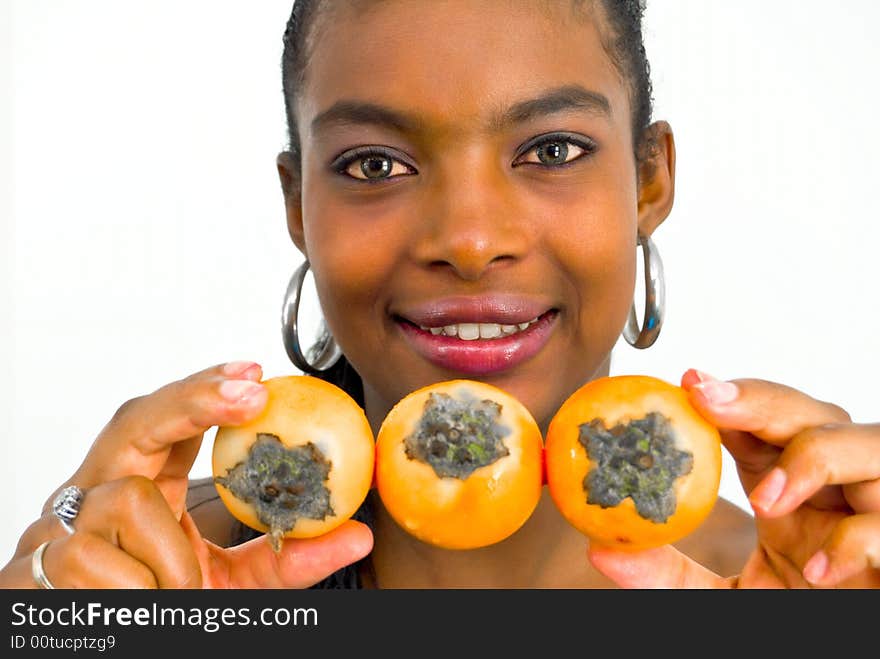 African girl with three yellow tropical fruits