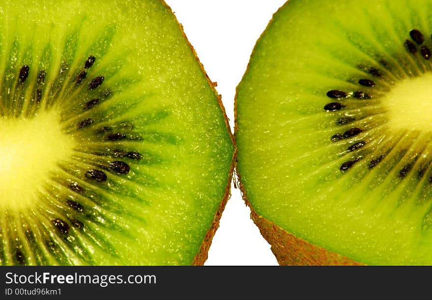 Two green fresh kiwi on the white background. Two green fresh kiwi on the white background