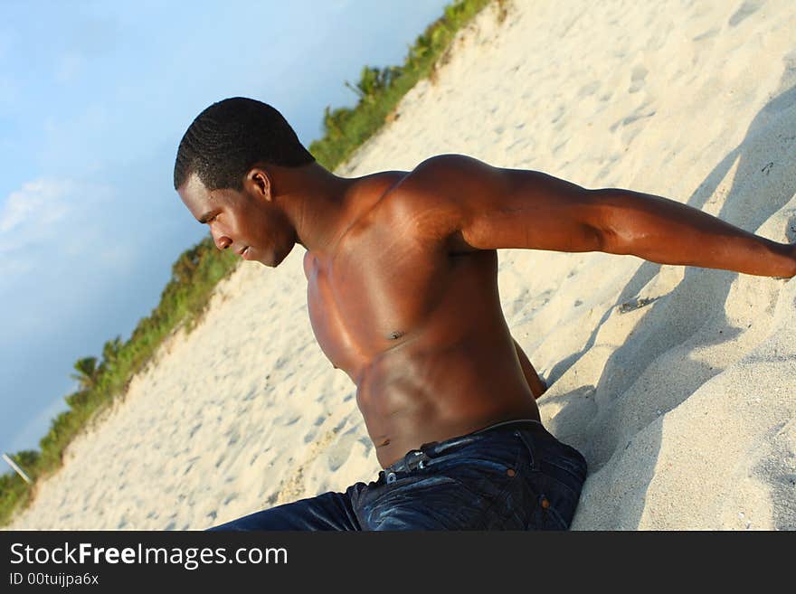 Man Relaxing on the beach sand. Man Relaxing on the beach sand