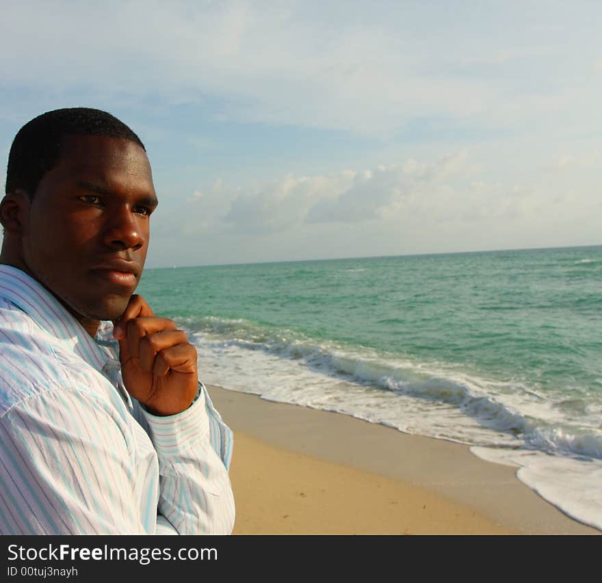 Attractive young black man by the sea shore. Attractive young black man by the sea shore