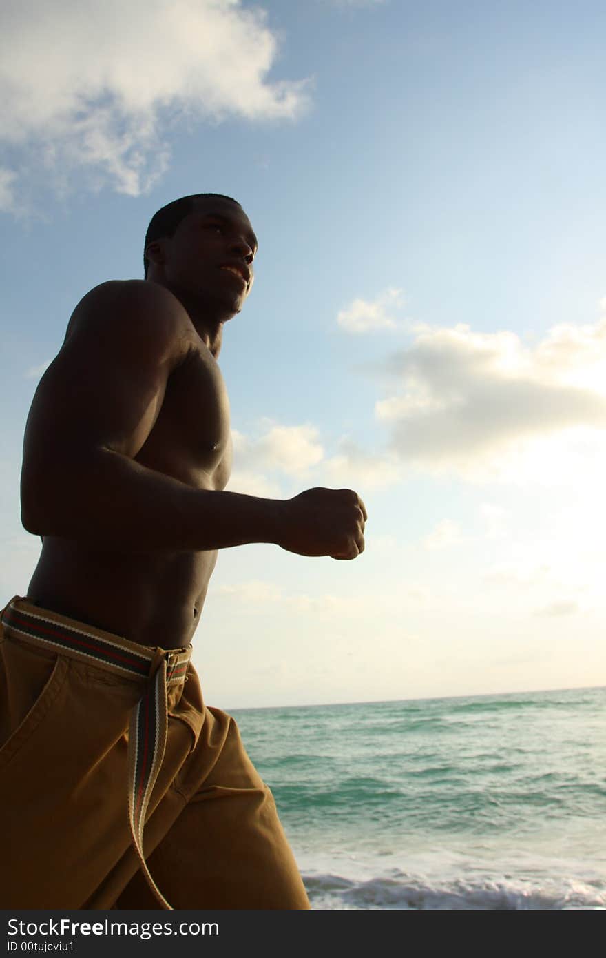 Man Running On The Beach