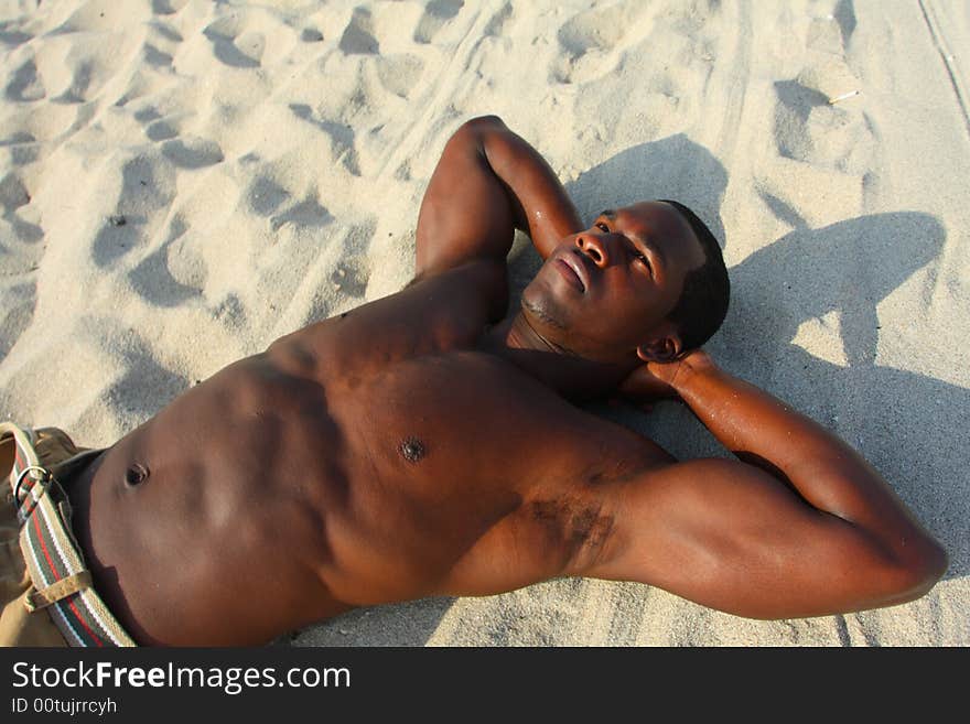 Man laying on the beach sand. Man laying on the beach sand