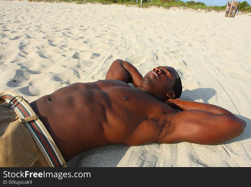 Man laying on the beach sand. Man laying on the beach sand